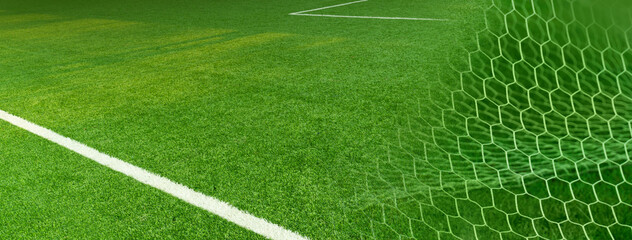 artificial green grass football or soccer field with white net goal banner background.
