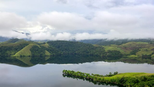 Jayapura, Papua, Indonesia, Timelapse view of Sentani Lake at moring cloudy.
