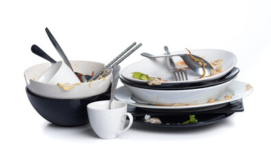 Dirty dishes pile needing washing isolated on white background