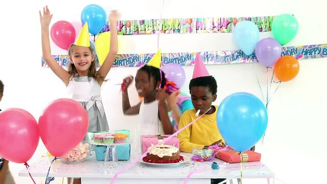 Animation of burn layer revealing children having fun at birthday party