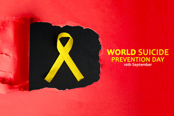 Red torn paper showing a yellow ribbon