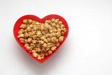 Microwave freshly made caramel popcorn with drinks, all ready to watch series, movies or tv shows
