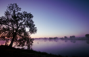 Fototapeta na wymiar Colorful sunrise over a Lake 