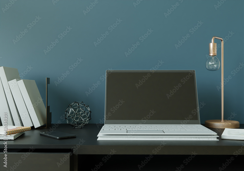 Poster a working room with a laptop with a lamp placed on the table.