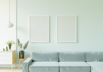 The living room is decorated with chairs, sofaand picture frames.