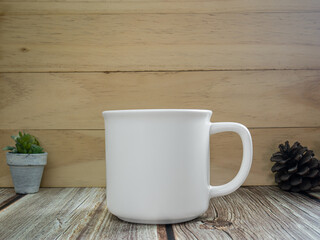 Fototapeta na wymiar white mug on table wood for mockup or background
