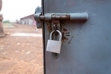 Close Up a rusty silver padlock on the light box.