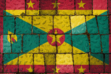 National flag of Grenada on stone  wall background. Flag  banner on  stone texture background.