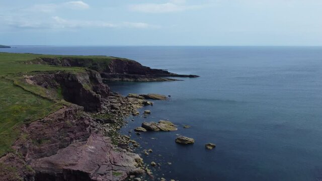 aerial flat of large cliffs in Brownstown Head - Ireland