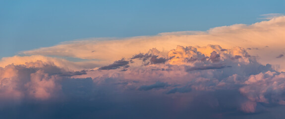 Orange sunset colorful heavenly clouds panoramic background and copy space