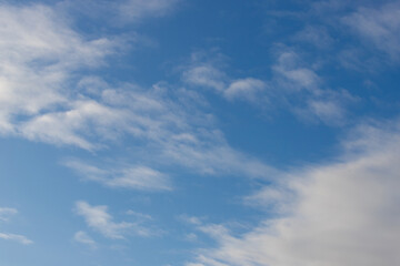 White clouds on sunny blue sky.