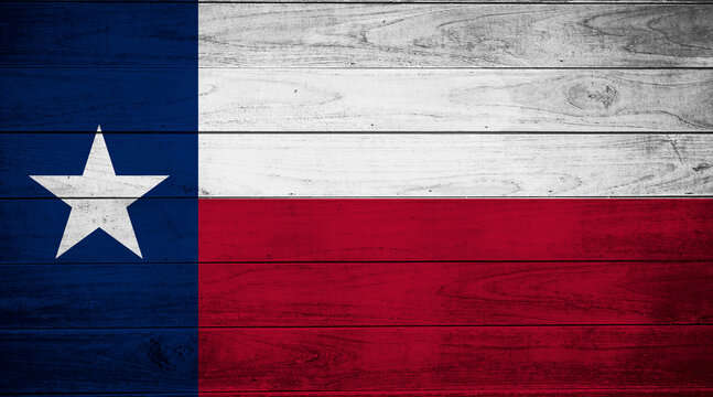 Flag of Texas on wooden old wall