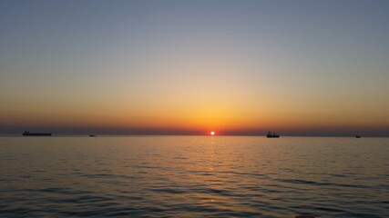 Sunset view of plantation in pacific ocean waters