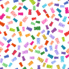 Seamless pattern of multicolored gummy bears on a white background