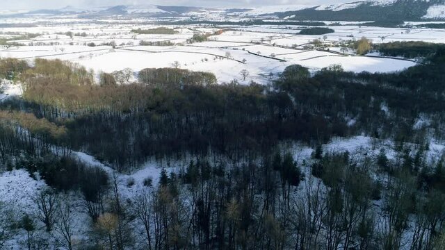 North York Moors Snow Scene Drone Flight, From Clay Bank, Urra Moor towards Roseberry Topping, Winter cold and moody clouds, Phantom 4 aerial, Clip 1
