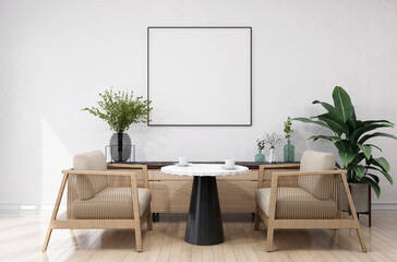 The living room consists of a sofa chair and a picture frame on the wall.