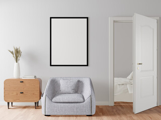 The living room consists of a sofa chair and a picture frame on the wall.