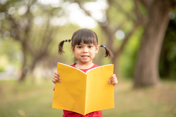 pretty girl The little girl is happy with the book