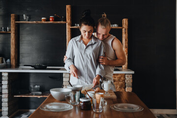 Young couple in love cook healthy food in the kitchen together. 