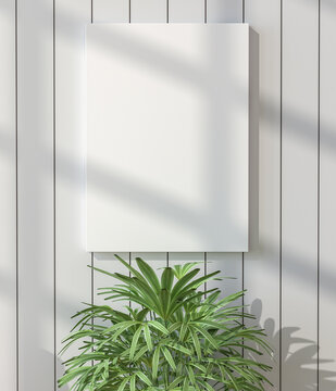 White picture frame on the wall with small plants
