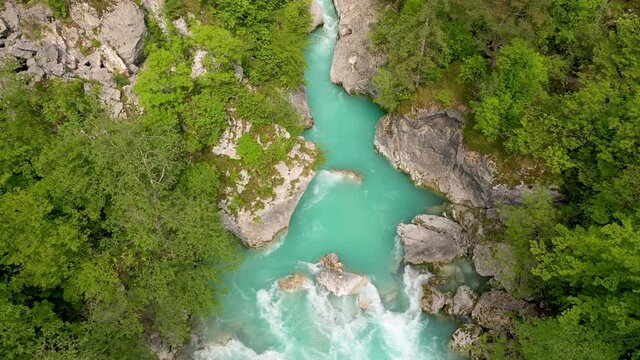 Aerial - Beautiful and majestic Soča river gorges surrounded by a forest