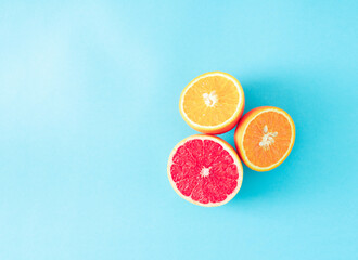 Citrus on a blue background as a minimal concept.