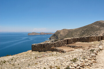 Panoramic view of the Inca ruins on the sun island or Isla del Sol overlooking Lake Titicaca, Bolivia.