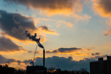 Orange sunset with smoke factory