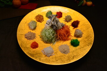 fresh colourful asian vegetables salad lo hei yu sheng with smoked salmon and sauces buffet for chinese new year menu