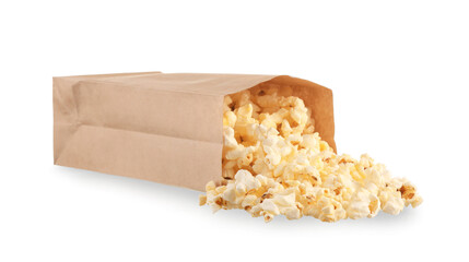 Paper bag with tasty popcorn on white background