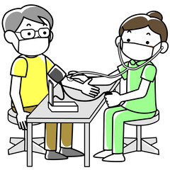 血圧測定をする女性看護師
