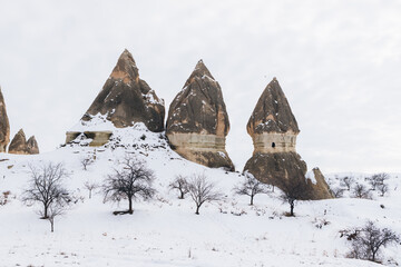 Snowy hills with unusual rocky cones in Monks Valley
