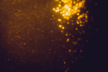Fototapeta na wymiar Glittering stars of blur gold bokeh