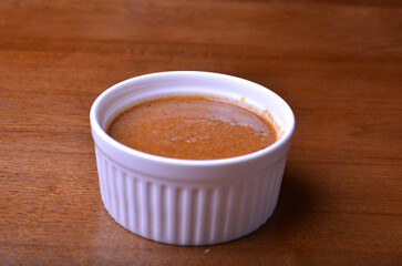 homemade curry sauce , mala spicy chilli sauce, satay peanut spicy chilli  sauce , roasted sesame sauce in bowl on wood table