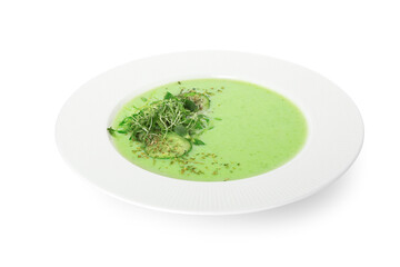 Plate with green gazpacho on white background