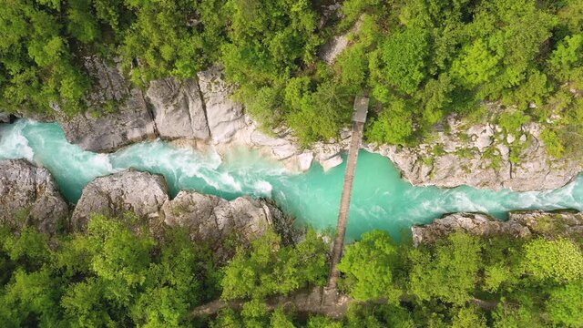 Aerial &ndash; Beautiful emerald river running through gorges and underneath a bridge
