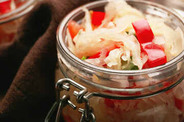 Glass jar with tasty sauerkraut, closeup
