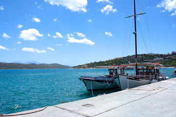 A small fishing boat moored to the quay in Crete