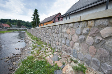 Modern flood protection wall in the style of the historic city wall. Permanent measures against...