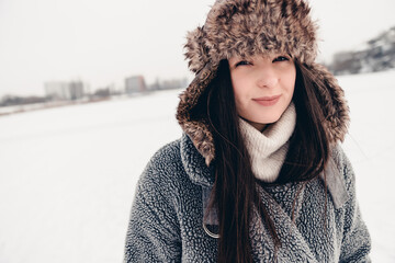 Portrait of a girl posing for a photo in the snowy winter season