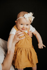 homemade photos of a pretty girl taken in her parents' bedroom when she is playing with mom lying on the bed