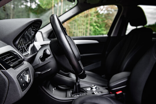 Car steering wheel side profile view. Lever for steering wheel adjustment.