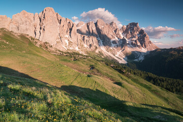 Fototapeta premium Beautiful summer mountain scenery. Splendid sunrise in Dolomites mountains. Panoramic summer view, Dolomiti Alps, South Tyrol, Italy, Europe. Traveling concept background. Sunny holiday.