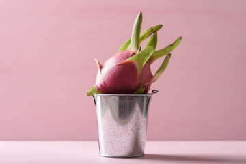 Ripe organic dragon fruit on pink background, tropical fruit mostly in Southeast Asia, refreshing and healthy eating sweet taste