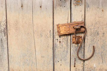 old vintage retro metal door lock on a wooden door with copy space