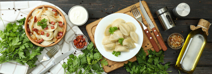 Concept of tasty food with vareniki or pierogi on wooden table