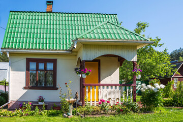 Moscow region, Russia - June 20, 2021: Country house in summer. In the summer, people leave city...
