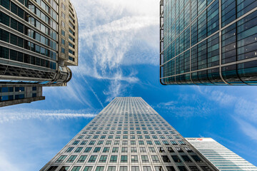 London skyscrapers view from below with blue sky and buildings with lots of windows and vanishing...