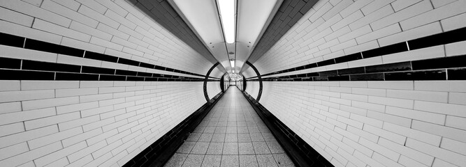 Tunnel Super Wide Angle of Tunnel Symmetrical Walkway with tiles on the ceiling and floor and walls