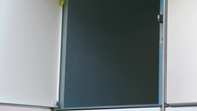 Taking out a parcel from a parcel locker in 4k slow motion 60fps